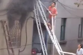 东阳民房起火12人被困 当地干部奋力爬梯救人终脱险图片