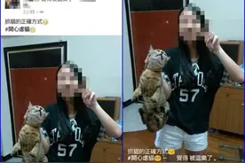 残忍抓猫颈自拍 惹怒网友：想甩她耳光图片