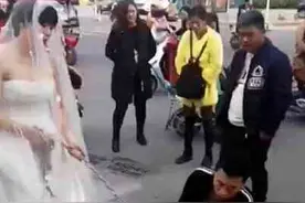 结婚当天新郎逃婚 彪悍新娘街头铁链捆上新郎去完婚图片
