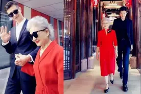 90岁“红裙奶奶”不服老走红，1米9孙子相伴，网友：赢在基因图片