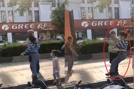 扬州电动车新规第二日 女子未戴头盔被罚怒扇交警耳光