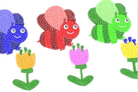 彩色豆拼图形 拼出花朵和蜜蜂