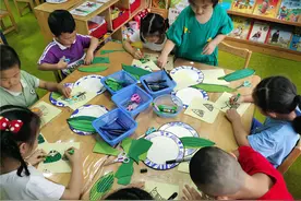 穿传统服装包粽子，长沙幼儿园迎端午欢乐多图片