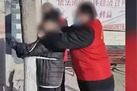 把违规的老人绑树上算哪门子“硬核防控”图片