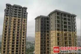 钦州多名业主因开发商欠缴土地出让金难入住，部门现同意验收部分楼栋，预计本月内可交房图片