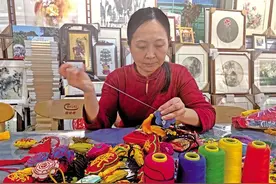 一针一线绣出广阔天地图片