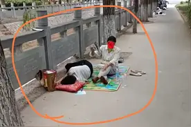 高考午休时，妈妈就地铺床让孩子休息，并一直扇风，引发热议图片