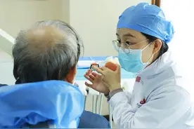 牙齿松动，拔还是留？还能固定吗？图片