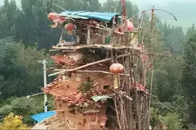 山东55岁智残老农捡泥3年，徒手盖出7层楼，苦等弟弟归来同住图片