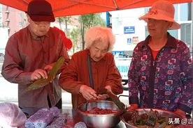 浓情端午 爱满社区——辉南县花园社区新时代文明实践站联合邮储银行开展端午活动图片