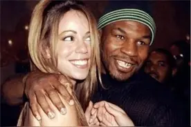 1988年，拳王泰森带着第一任妻子吉文斯走在街上，...图片