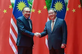 李强会见马来西亚总理安瓦尔图片
