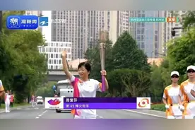 第49棒火炬手周爱芬：传递温暖与爱图片