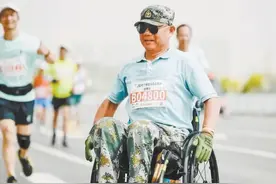 “轮椅跑者”的人生马拉松图片