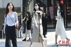 重庆气温超21℃ 女子短裙出街图片
