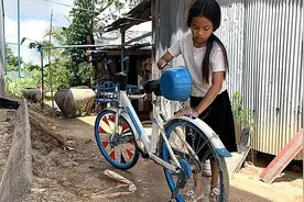 中国共享单车助力柬埔寨孩子上学路 1000辆哈啰单车焕发新生图片