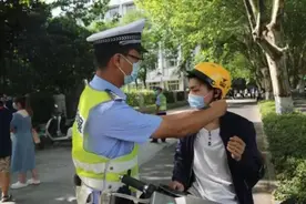 郑州严查骑电动车不戴头盔满一个月：处罚违法31万人次，头盔佩戴率已超80%图片