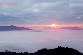 美若仙境！云南基诺山现壮观“丁达尔”日出