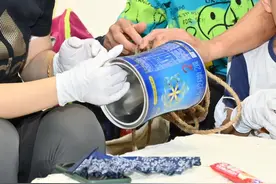 “罐盖新生”奶粉罐环保回收计划再启动图片