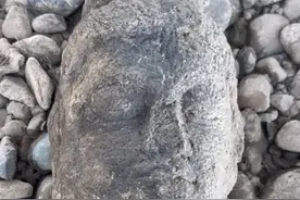 男子钓鱼时在龙门石窟附近发现佛头，龙门石窟研究院：尚未确定是否为文物图片