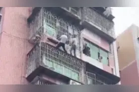 “为英雄点赞！”女孩悬挂窗外，邻居冒雨爬窗救下图片