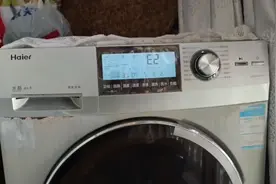海尔洗衣机可以洗，可以甩，工作结束后不开门，报E2故障怎么办