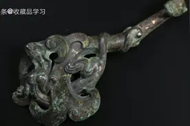 古董收藏 详细解说成交价66000多元的 战国铜错金银龙首带钩